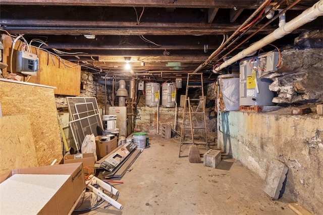 basement with water heater and electric water heater