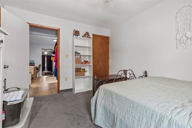 bedroom featuring dark colored carpet