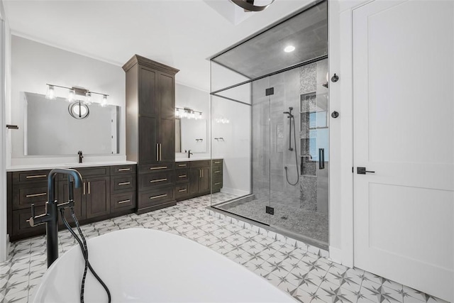 bathroom featuring separate shower and tub and vanity