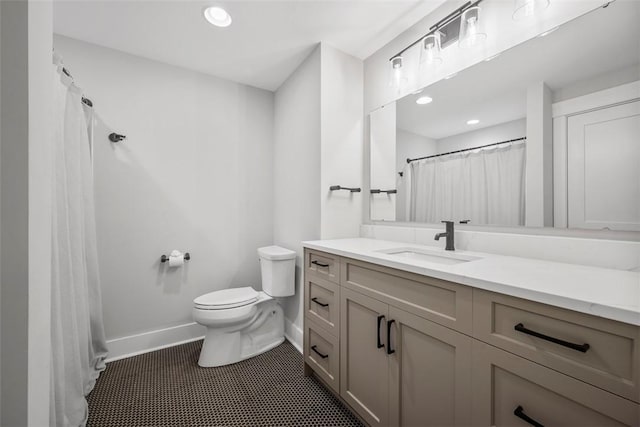 bathroom featuring toilet and vanity