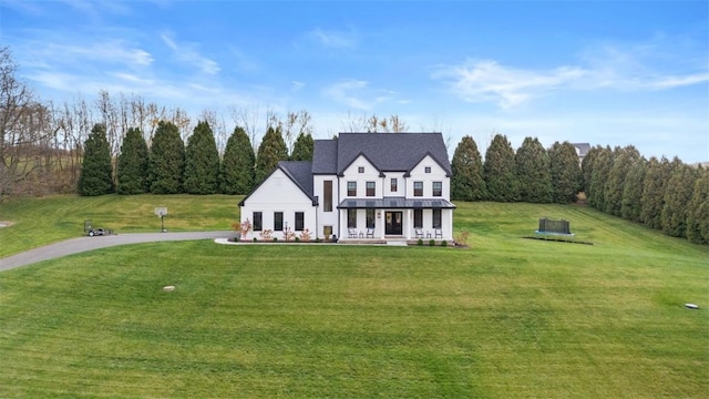 view of front of home featuring a front lawn and a porch