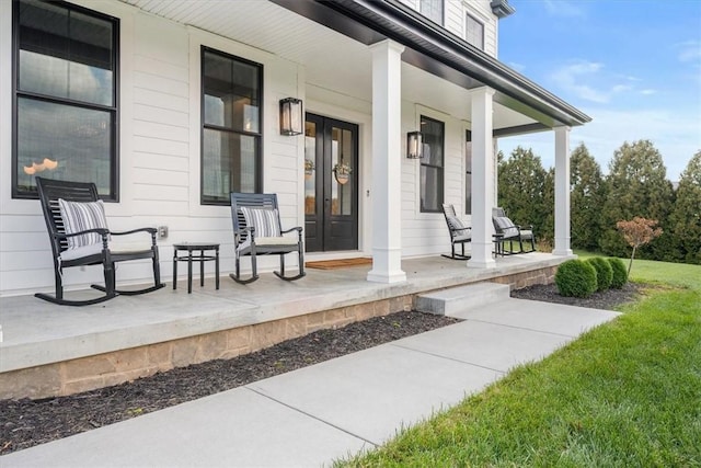 doorway to property featuring covered porch