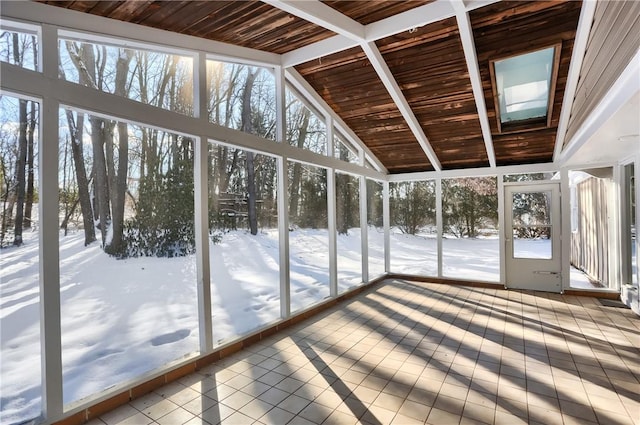 unfurnished sunroom with vaulted ceiling