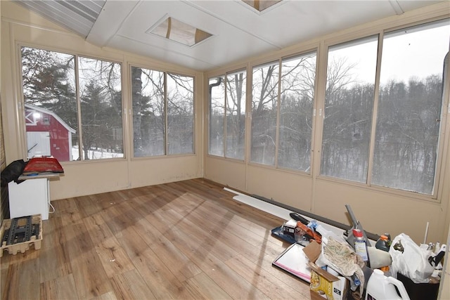 unfurnished sunroom with vaulted ceiling