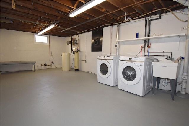 washroom with sink and independent washer and dryer