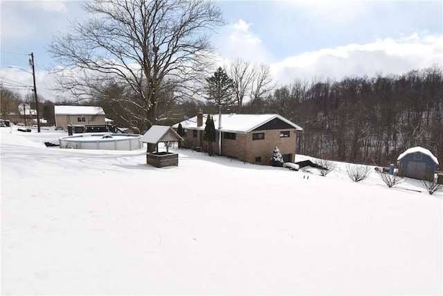 view of yard layered in snow