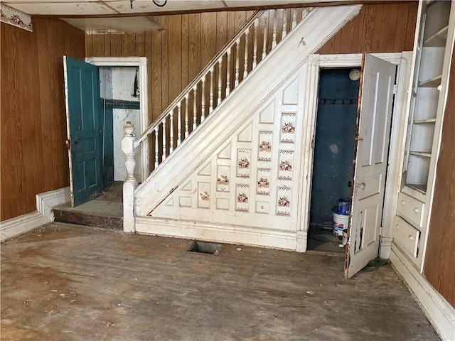 interior space featuring wood walls