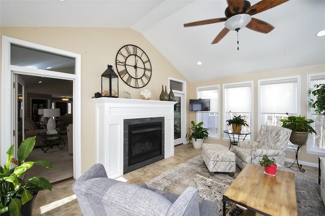 living room with vaulted ceiling, ceiling fan, and built in shelves