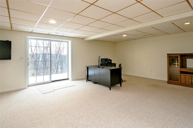 carpeted office with a drop ceiling