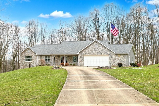 view of front of house featuring a garage and a front yard