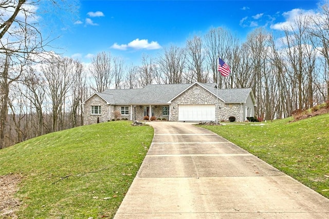 view of front of house featuring a garage and a front yard