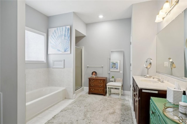 bathroom featuring vanity, tile patterned flooring, and plus walk in shower