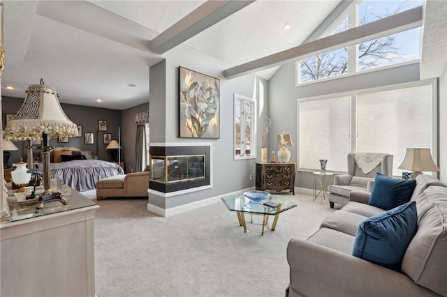 bedroom featuring light carpet, a multi sided fireplace, and beam ceiling