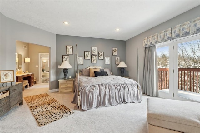 bedroom featuring access to exterior, ensuite bathroom, and light carpet