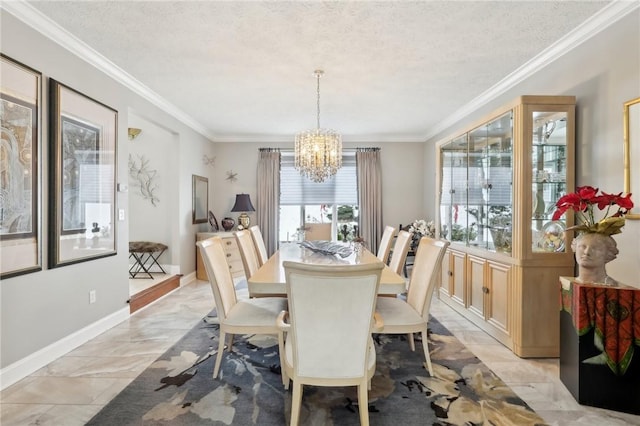 dining space with a textured ceiling, crown molding, and an inviting chandelier