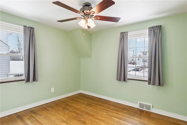 unfurnished room featuring ceiling fan and wood-type flooring