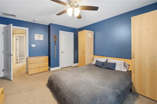 bedroom with ceiling fan and carpet