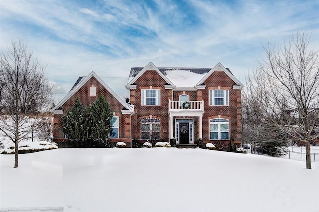 view of front of home featuring a balcony