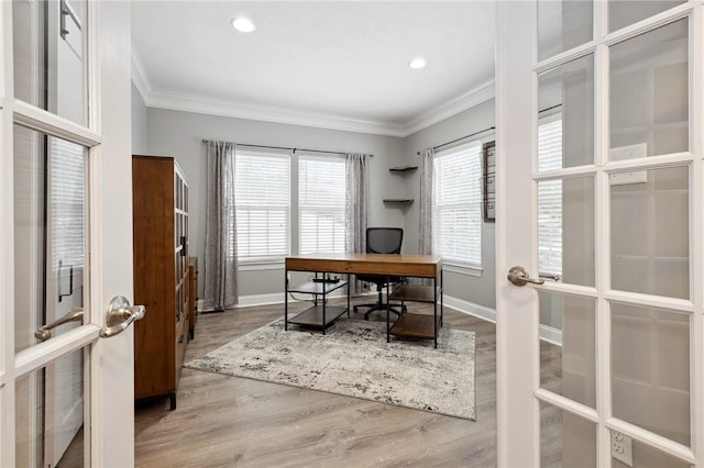 office with french doors, plenty of natural light, crown molding, and wood-type flooring