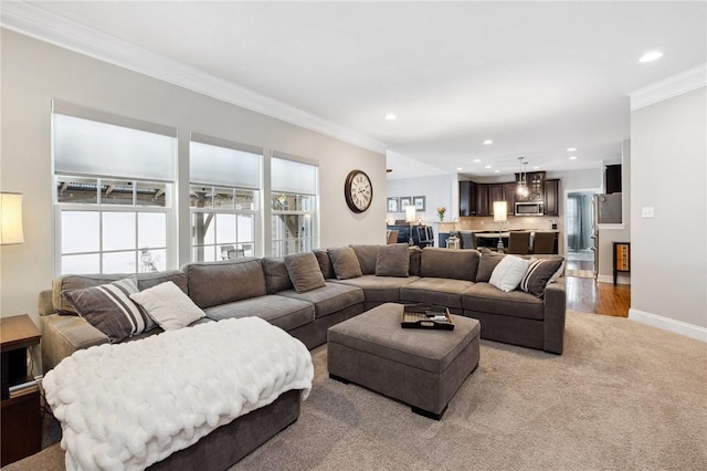 carpeted living room featuring crown molding