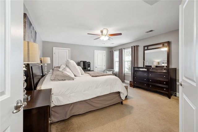 carpeted bedroom featuring ceiling fan