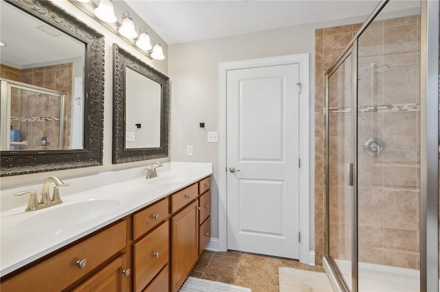 bathroom featuring vanity and a shower with door