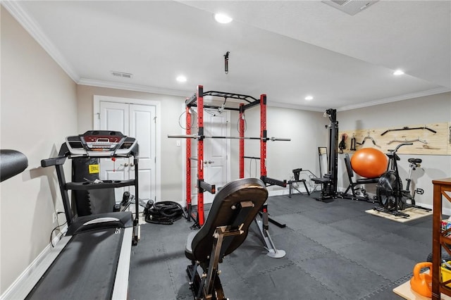 workout room with ornamental molding