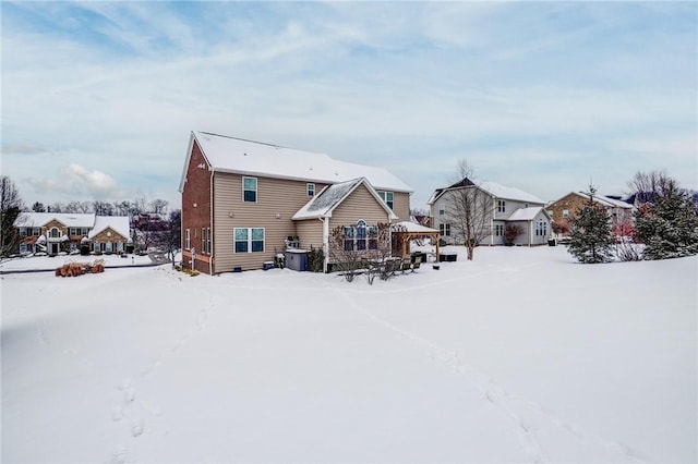 view of snow covered house