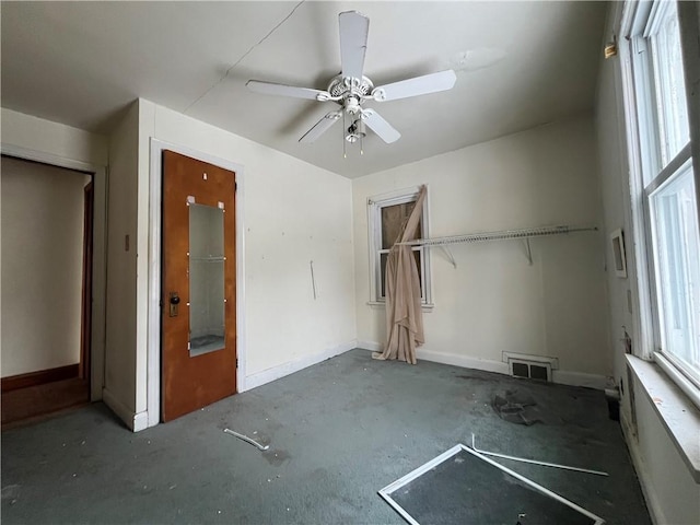 unfurnished bedroom with a closet and ceiling fan