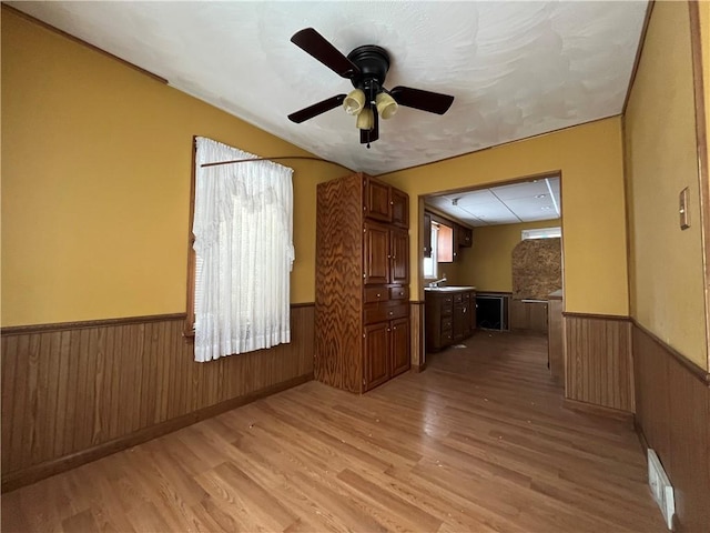 spare room with light hardwood / wood-style floors and ceiling fan