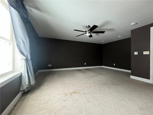 carpeted empty room with ceiling fan