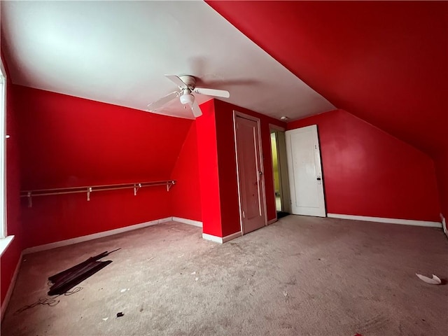 additional living space with ceiling fan and lofted ceiling