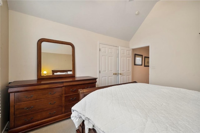 bedroom with a closet and lofted ceiling