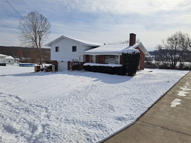 view of snow covered property