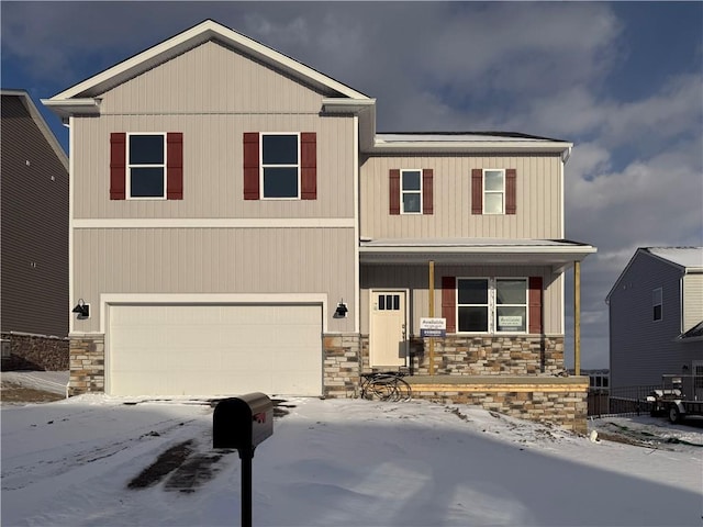 view of front of property featuring a garage and a porch