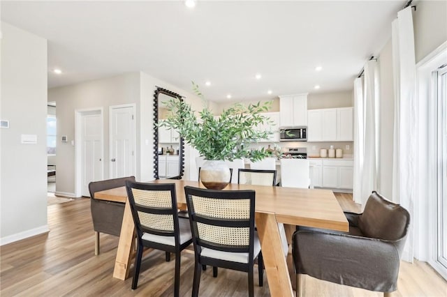 dining space featuring light hardwood / wood-style flooring