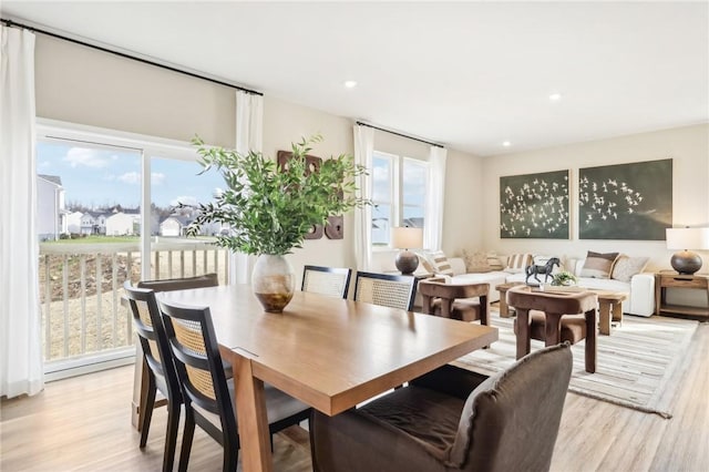 dining area with light hardwood / wood-style floors