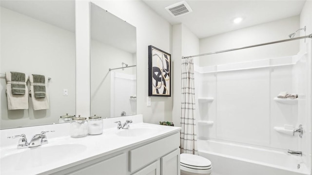 full bathroom featuring toilet, vanity, and shower / bath combo with shower curtain