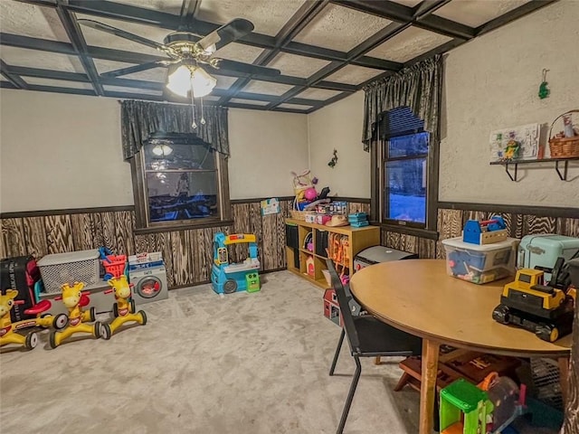 recreation room featuring light carpet, beamed ceiling, and coffered ceiling