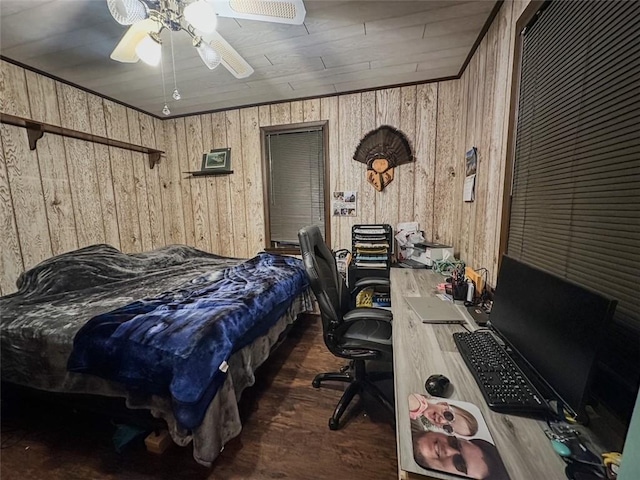 bedroom featuring ceiling fan, wooden walls, and wooden ceiling