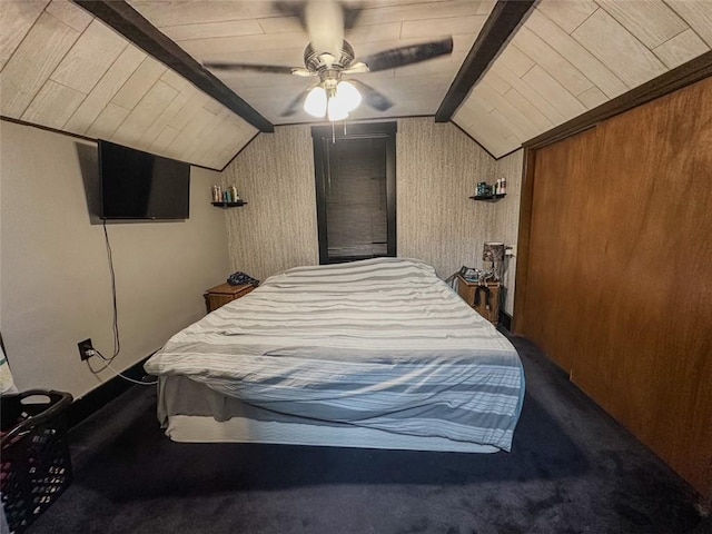 bedroom with ceiling fan, lofted ceiling with beams, carpet, and wooden walls