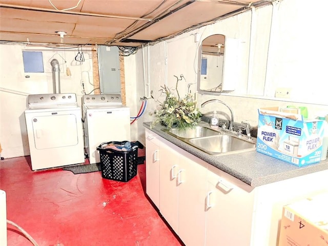 laundry area with separate washer and dryer, electric panel, and sink