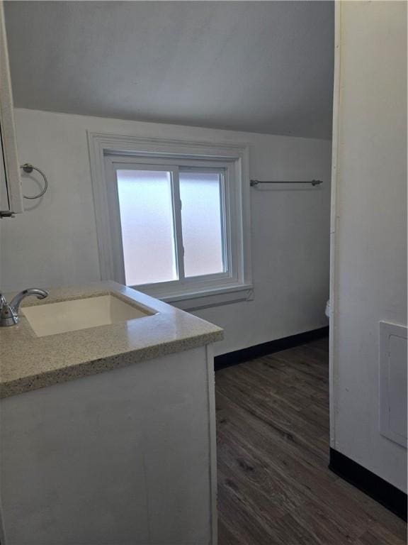 kitchen featuring sink and dark hardwood / wood-style floors