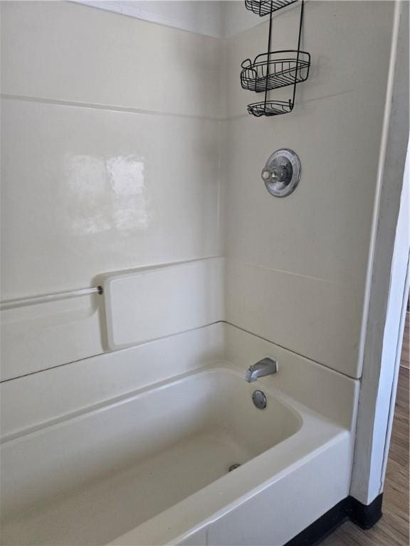 bathroom featuring shower / bath combination and wood-type flooring