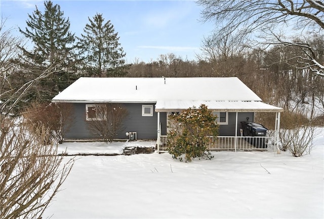 view of snow covered house