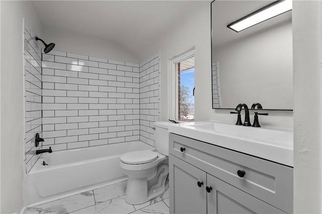 full bathroom with toilet, tiled shower / bath, and vanity