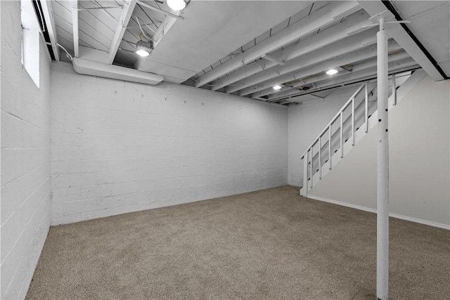 basement featuring carpet flooring