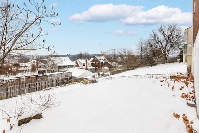 view of yard covered in snow