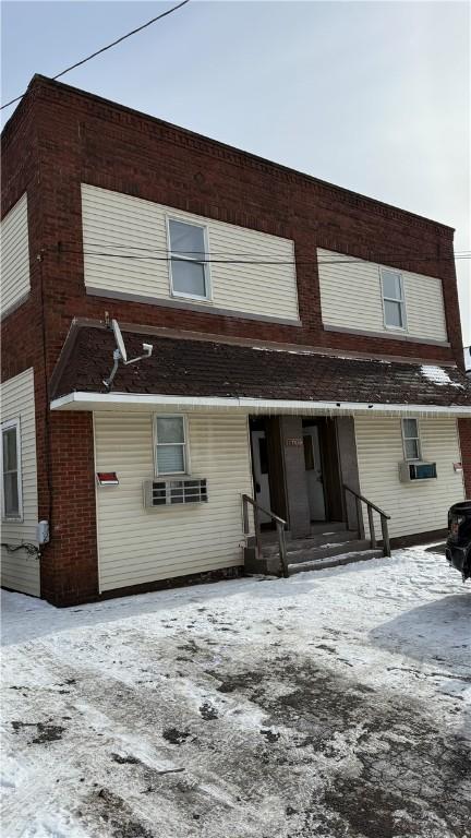 view of snow covered property