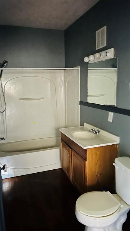 full bathroom featuring toilet, shower / tub combination, and vanity